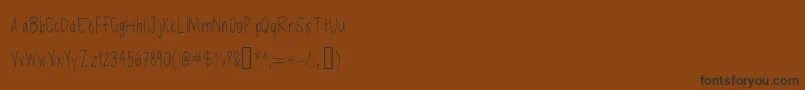 Czcionka Defenseless – czarne czcionki na brązowym tle