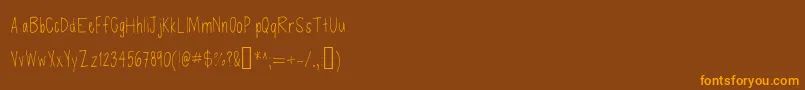Czcionka Defenseless – pomarańczowe czcionki na brązowym tle