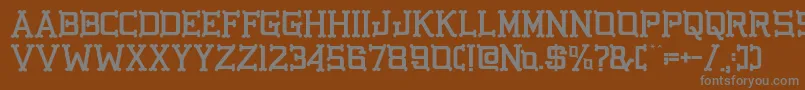 GbgoldenbonesRegular Font – Gray Fonts on Brown Background