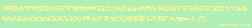 フォントYamamotol – 黄色の文字が緑の背景にあります