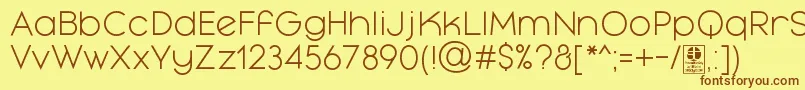 フォントMayekaLightDemo – 茶色の文字が黄色の背景にあります。