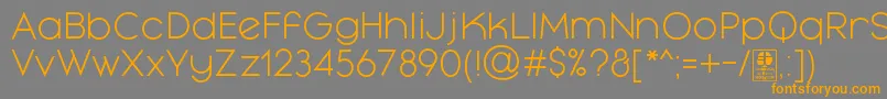 フォントMayekaLightDemo – オレンジの文字は灰色の背景にあります。