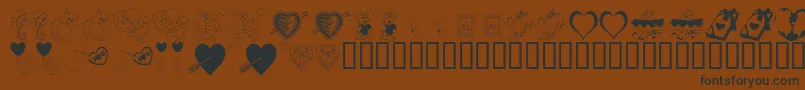 フォントKrBeMine – 黒い文字が茶色の背景にあります