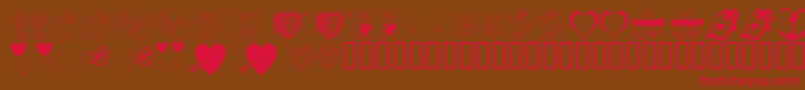 フォントKrBeMine – 赤い文字が茶色の背景にあります。