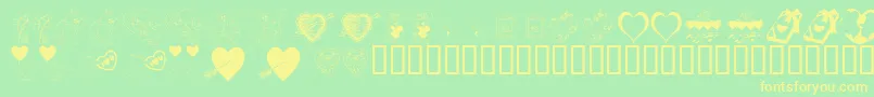 フォントKrBeMine – 黄色の文字が緑の背景にあります