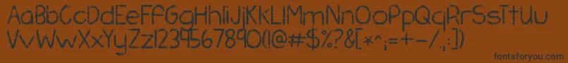 Kgchasingpavements Font – Black Fonts on Brown Background