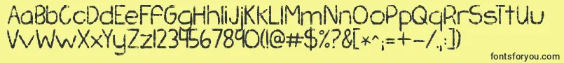 Kgchasingpavements Font – Black Fonts on Yellow Background