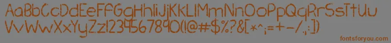 Kgchasingpavements Font – Brown Fonts on Gray Background
