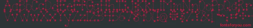 フォントJandasparkleandshinebold – 黒い背景に赤い文字