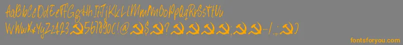 フォントDkHeyComrade – オレンジの文字は灰色の背景にあります。