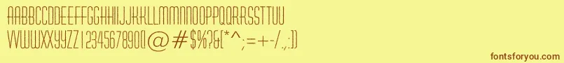 フォントHuxleyroughRegular – 茶色の文字が黄色の背景にあります。