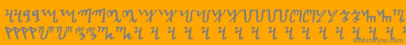 Theban-Schriftart – Graue Schriften auf orangefarbenem Hintergrund