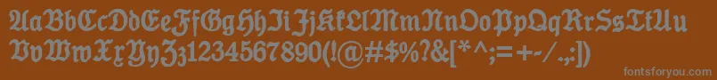 KoenigTypeBold-fontti – harmaat kirjasimet ruskealla taustalla
