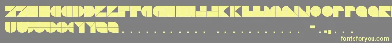 Czcionka DrebiekExpandedRegular – żółte czcionki na szarym tle
