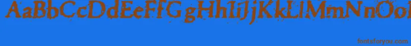 フォントPettra – 茶色の文字が青い背景にあります。