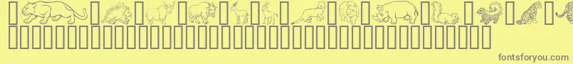 フォントWildKingdomPToZ – 黄色の背景に灰色の文字