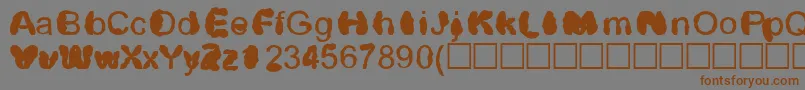 フォントDistrowt – 茶色の文字が灰色の背景にあります。