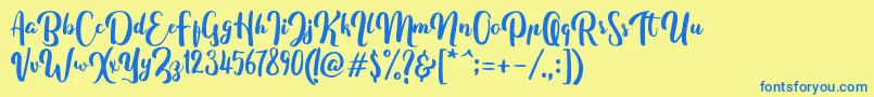 フォントFitamintScript – 青い文字が黄色の背景にあります。