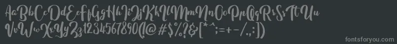 フォントFitamintScript – 黒い背景に灰色の文字