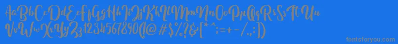 Fonte FitamintScript – fontes cinzas em um fundo azul