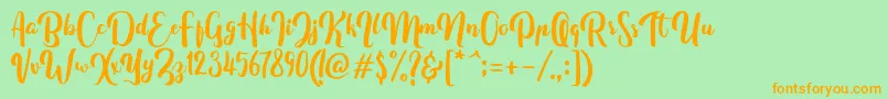 FitamintScript Font – Orange Fonts on Green Background