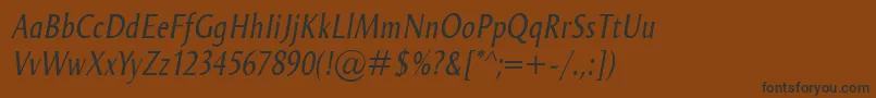 フォントOdenseCondItalic – 黒い文字が茶色の背景にあります