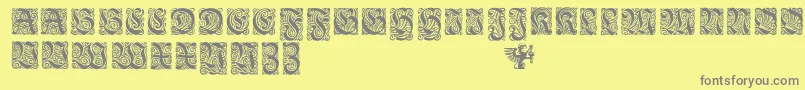 Fonte EhmckeFrakturInitialen – fontes cinzas em um fundo amarelo