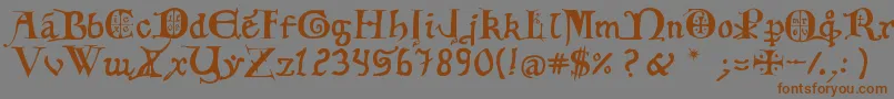フォント12th C  Fancy Caps – 茶色の文字が灰色の背景にあります。
