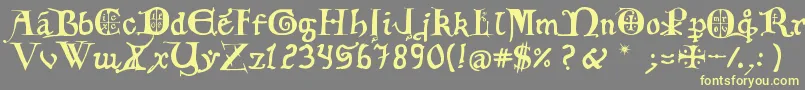 12th C  Fancy Caps-Schriftart – Gelbe Schriften auf grauem Hintergrund