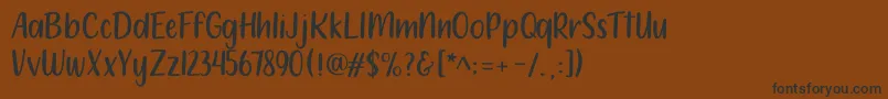 212 Moon Child Sans Font – Black Fonts on Brown Background