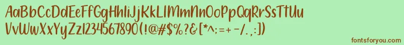 212 Moon Child Sans-Schriftart – Braune Schriften auf grünem Hintergrund