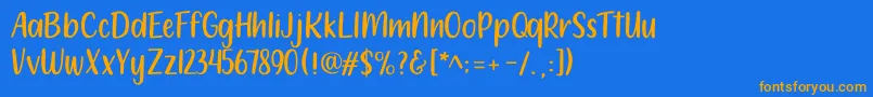 フォント212 Moon Child Sans – オレンジ色の文字が青い背景にあります。