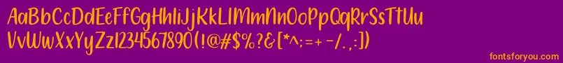 フォント212 Moon Child Sans – 紫色の背景にオレンジのフォント