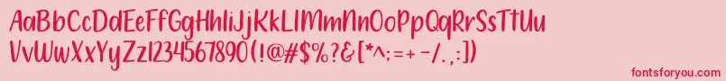 フォント212 Moon Child Sans – ピンクの背景に赤い文字