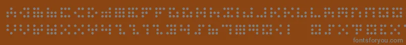 3x3dots Font – Gray Fonts on Brown Background