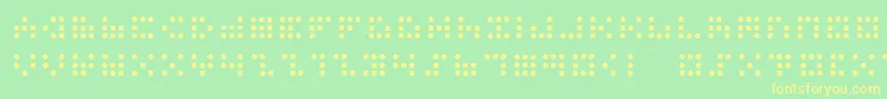 3x3dots-Schriftart – Gelbe Schriften auf grünem Hintergrund