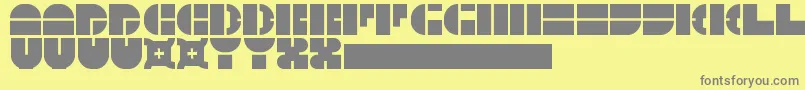 フォント5Megabam – 黄色の背景に灰色の文字