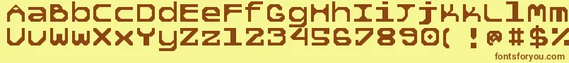 フォント5tekknosystem – 茶色の文字が黄色の背景にあります。