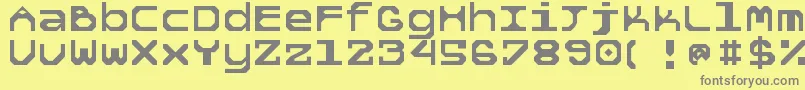 5tekknosystem-Schriftart – Graue Schriften auf gelbem Hintergrund