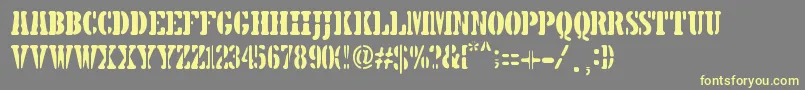 フォント5TH AVENUE STENCIL – 黄色のフォント、灰色の背景