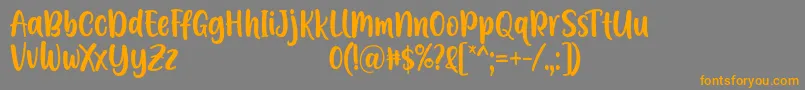 Czcionka A Calling Font D by 7NTypes – pomarańczowe czcionki na szarym tle