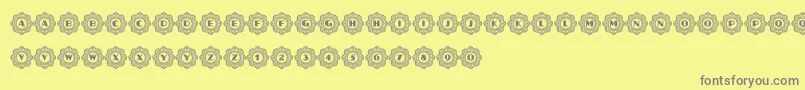 Fonte AafiaCapitals – fontes cinzas em um fundo amarelo