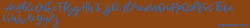 Abhyaksa FREE Font – Blue Fonts on Brown Background