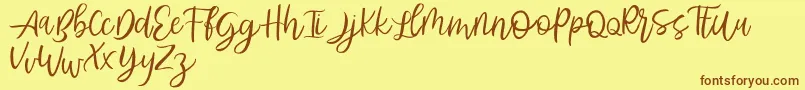 Abhyaksa FREE Font – Brown Fonts on Yellow Background