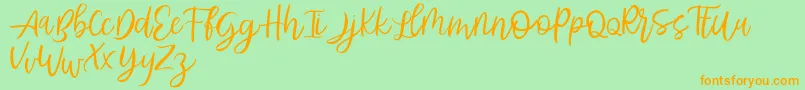 Abhyaksa FREE-Schriftart – Orangefarbene Schriften auf grünem Hintergrund