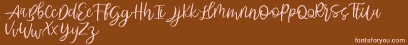 Abhyaksa FREE Font – Pink Fonts on Brown Background