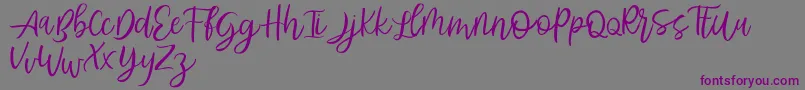 Abhyaksa FREE-Schriftart – Violette Schriften auf grauem Hintergrund