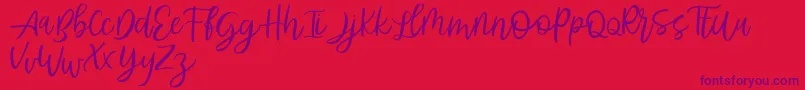 Abhyaksa FREE-Schriftart – Violette Schriften auf rotem Hintergrund