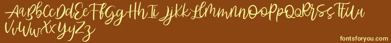 Abhyaksa FREE Font – Yellow Fonts on Brown Background