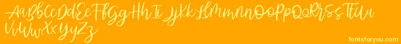 Abhyaksa FREE Font – Yellow Fonts on Orange Background